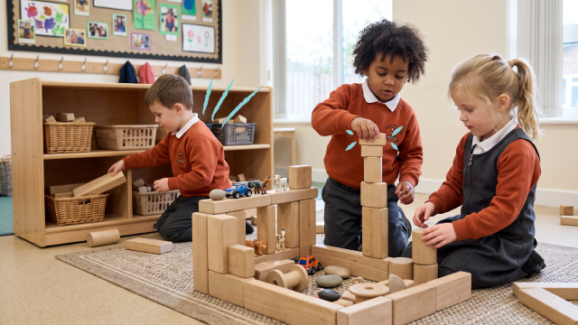 Early year students playing with blocks