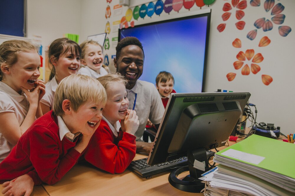 teacher showing students work