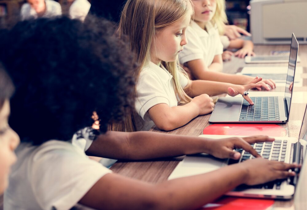 students learning on a laptop